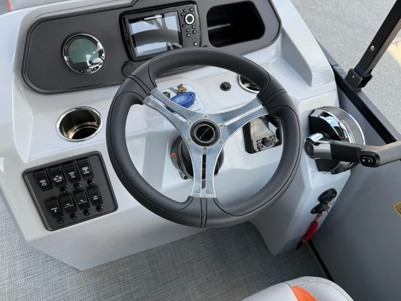 Slide: The Image of Steering console of 2025 Bentley Pontoons Bolt 203 with modern controls and navigation system. - 24