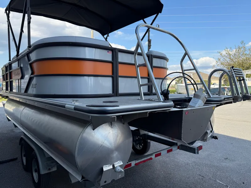 Slide: The Image of 2025 Bentley Pontoons Bolt 203 on trailer, featuring sleek design and vibrant orange accents. - 28