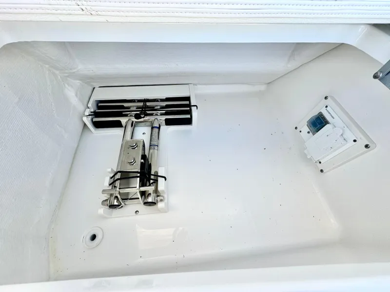Slide: The Image of Storage compartment of 2025 Tiara Yachts 34 LX, featuring clean interior and mounted equipment. - 37