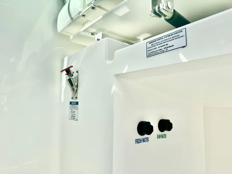 Slide: The Image of 2025 Tiara Yachts 34 LX water system controls, featuring fresh and raw water options. - 46