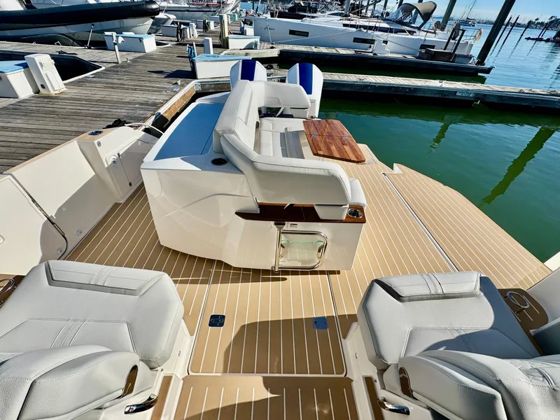 Slide: The Image of 2025 Tiara Yachts 43 LE luxury yacht interior with plush seating and wooden accents. - 35