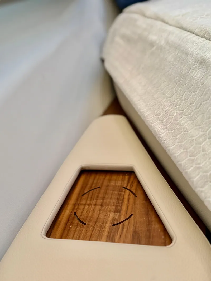 Slide: The Image of Interior detail of 2025 Tiara Yachts 43 LE, featuring elegant wood and upholstery design. - 46