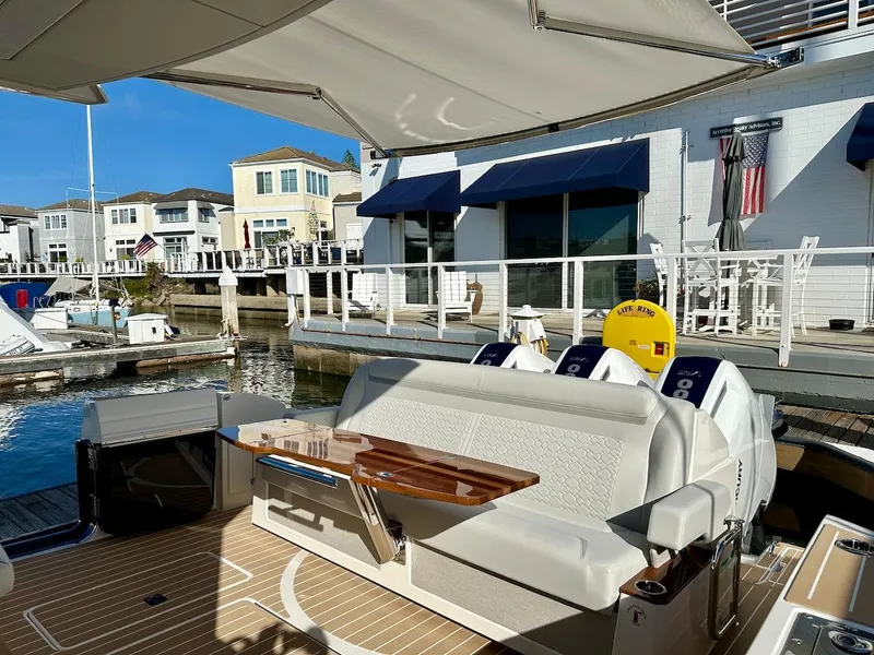 Slide: The Image of 2025 Tiara Yachts 48 LE, luxury yacht interior with waterfront view. - 13