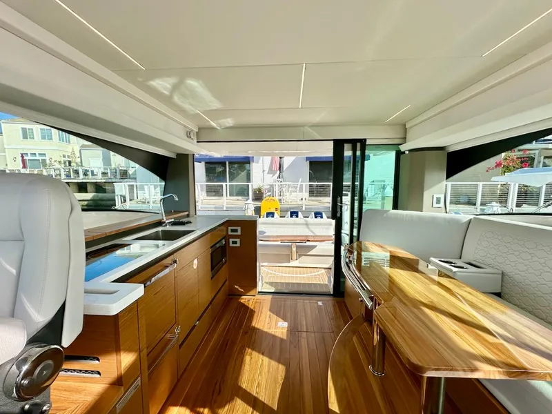 Slide: The Image of Luxurious interior of 2025 Tiara Yachts 48 LE, featuring elegant wood finishes and modern design. - 20