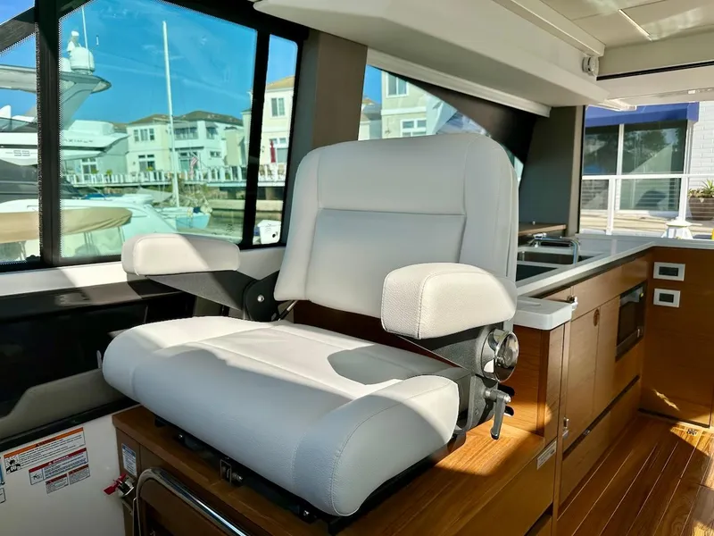 Slide: The Image of Captain's chair in 2025 Tiara Yachts 48 LE, luxurious interior design. - 23