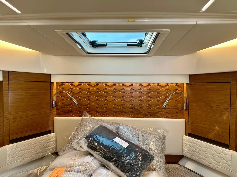 Slide: The Image of Luxurious interior cabin of 2025 Tiara Yachts 48 LE with elegant wood paneling. - 34