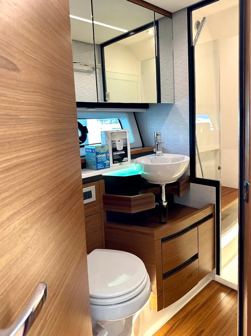 Slide: The Image of Luxurious bathroom in 2025 Tiara Yachts 48 LE, featuring modern fixtures and wood accents. - 35