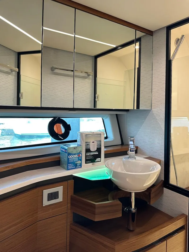 Slide: The Image of Luxurious bathroom interior of 2025 Tiara Yachts 48 LE with modern fixtures and ample storage. - 36