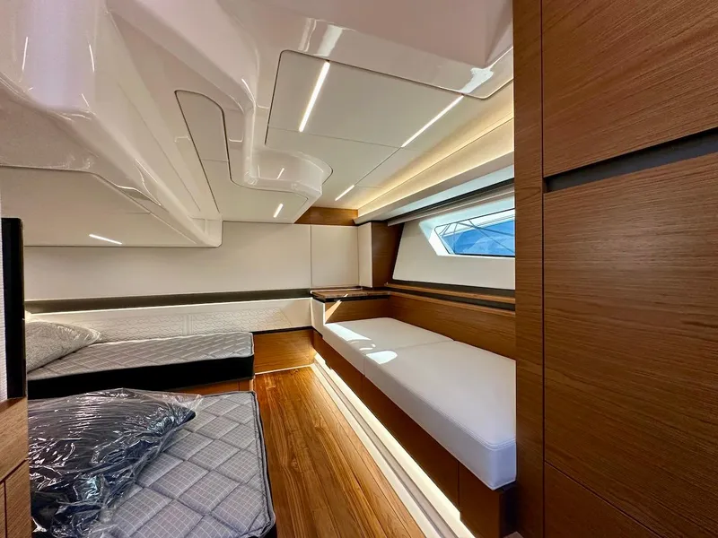 Slide: The Image of Interior of 2025 Tiara Yachts 48 LE, featuring modern wood finishes and sleek design. - 40