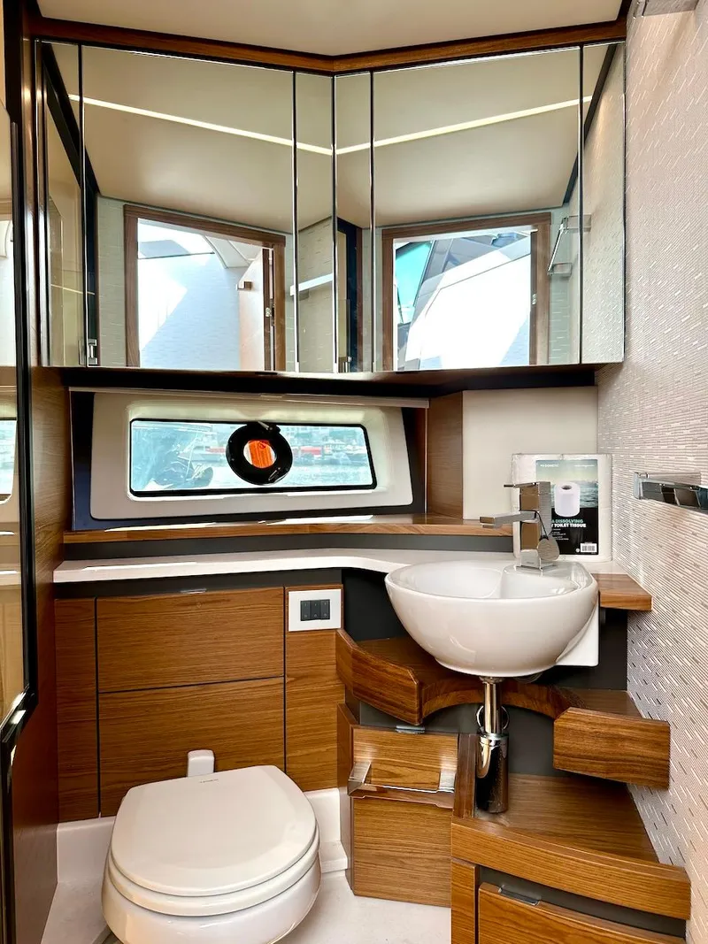 Slide: The Image of Luxurious bathroom in 2025 Tiara Yachts 48 LE, featuring modern fixtures and elegant wood accents. - 45
