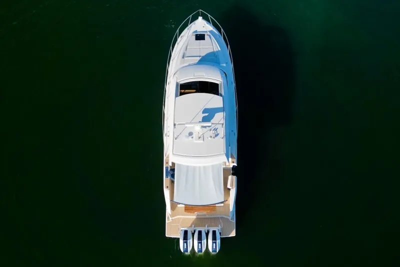 Slide: The Image of 2025 Tiara Yachts 48 LE, aerial view, sleek design, luxury yacht on water. - 5