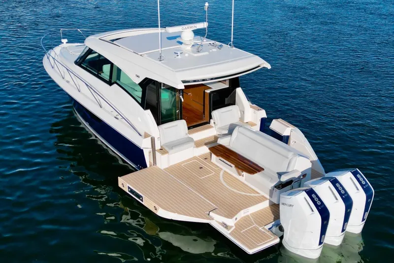 Slide: The Image of 2025 Tiara Yachts 48 LE on water, showcasing sleek design and powerful engines. - 8