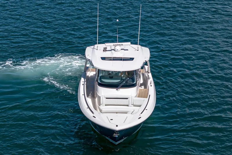 Slide: The Image of 2024 Tiara Yachts 38 LS cruising on open water, aerial view. - 13