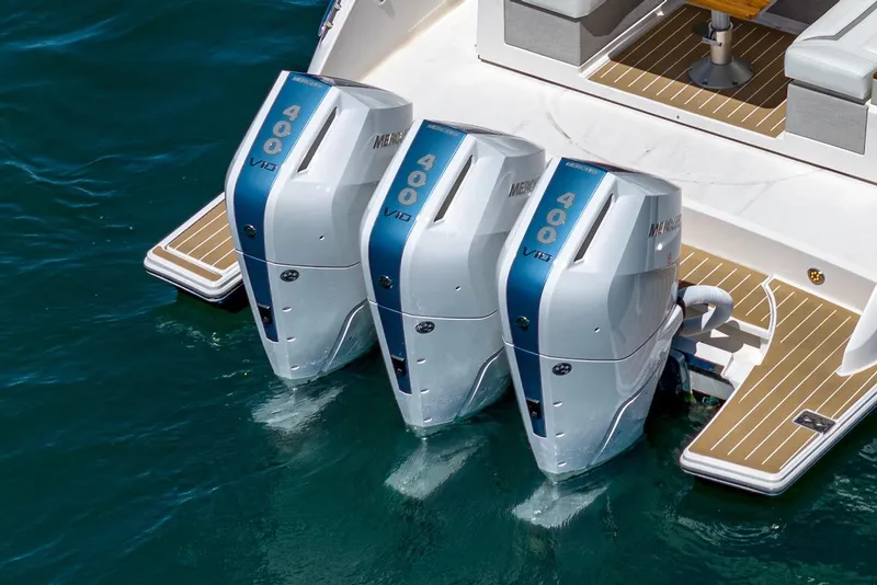 Slide: The Image of 2024 Tiara Yachts 38 LS with triple 400 horsepower outboard engines on water. - 23