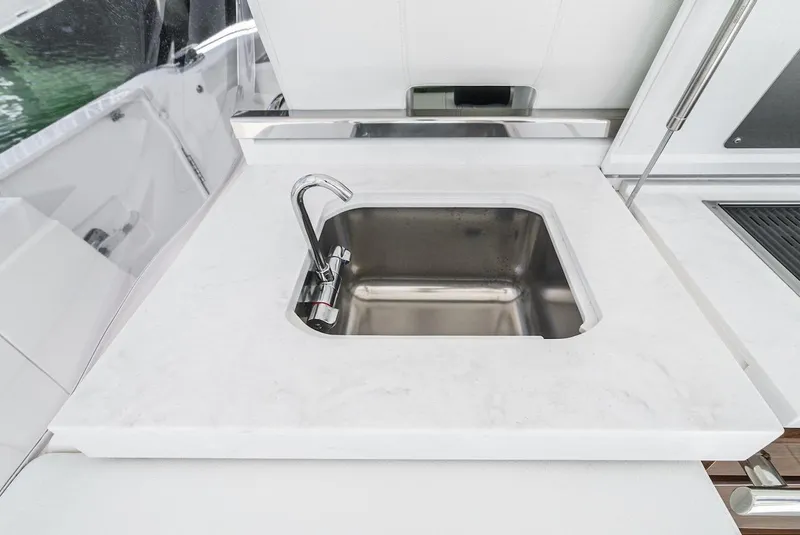 Slide: The Image of 2024 Tiara Yachts 38 LS yacht sink with modern countertop design. - 38