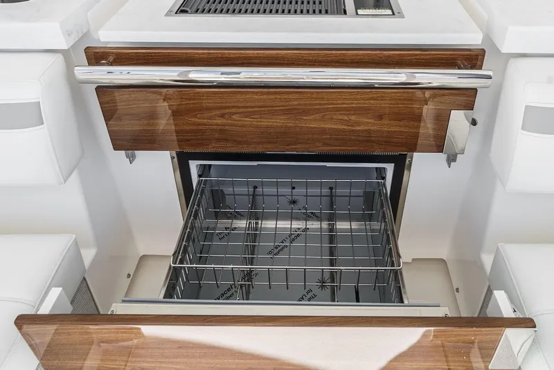Slide: The Image of 2024 Tiara Yachts 38 LS interior with open drawer and grill. - 40