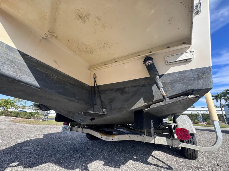 Slide: The Image of 2005 Parker 2520 Deep Vee Sport Cabin boat on trailer, rear view showing hull and trim tabs. - 12