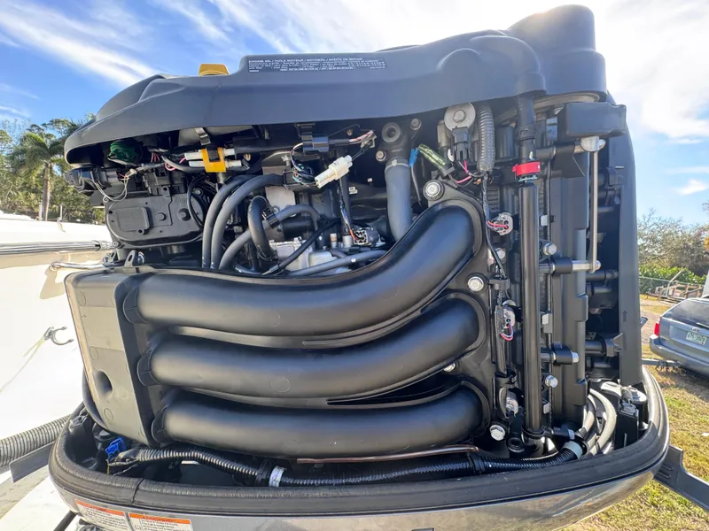 Slide: The Image of 2005 Parker 2520 Deep Vee Sport Cabin engine, detailed view of components and wiring. - 19