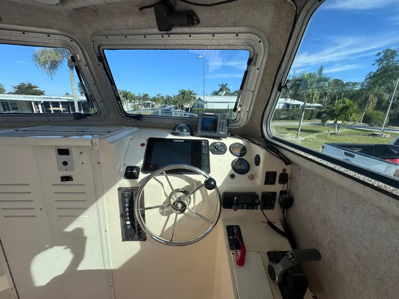 Slide: The Image of Interior view of 2005 Parker 2520 Deep Vee Sport Cabin boat cockpit. - 23
