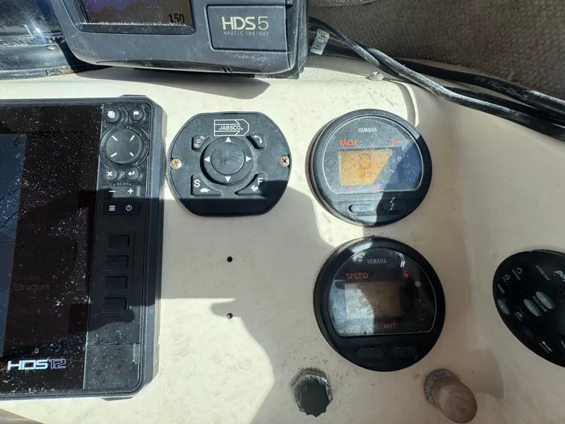 Slide: The Image of Control panel of a 2005 Parker 2520 Deep Vee Sport Cabin boat. - 26