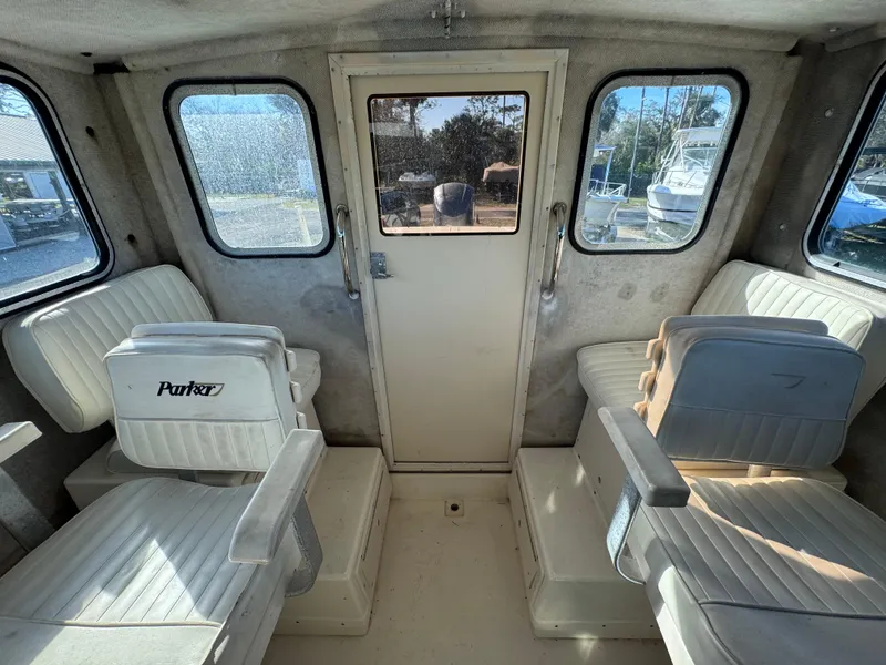 Slide: The Image of Interior of 2005 Parker 2520 Deep Vee Sport Cabin with seating and windows. - 32
