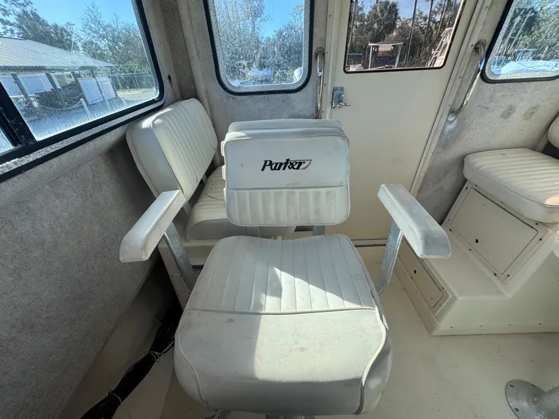 Slide: The Image of 2005 Parker 2520 Deep Vee Sport Cabin interior with white seating. - 33