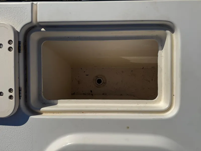 Slide: The Image of Empty storage compartment on a 2005 Parker 2520 Deep Vee Sport Cabin boat. - 37