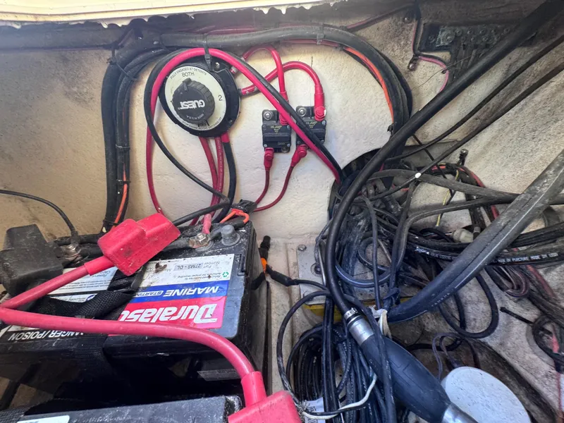 Slide: The Image of Battery compartment of a 2005 Parker 2520 Deep Vee Sport Cabin boat with wiring and connections. - 38