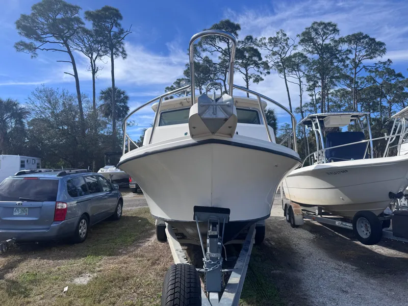 Slide: The Image of 2005 Parker 2520 Deep Vee Sport Cabin boat on trailer, parked outdoors. - 4