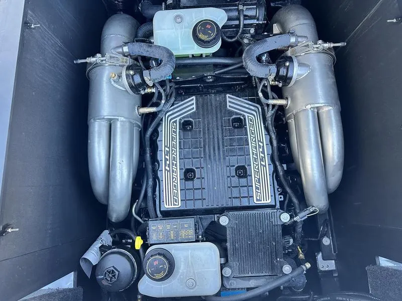 Slide: The Image of 2022 Axis A24 engine compartment with dual exhaust and cooling systems. - 13