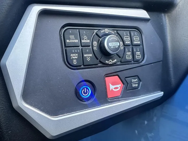 Slide: The Image of Control panel of a 2022 Axis A24 boat with various function buttons. - 16