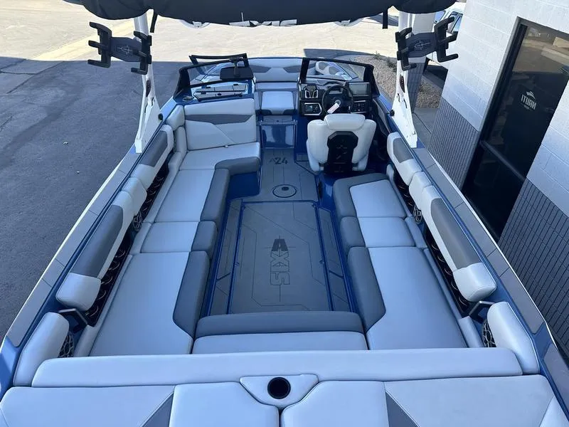 Slide: The Image of 2022 Axis A24 boat interior with spacious seating and modern dashboard. - 6