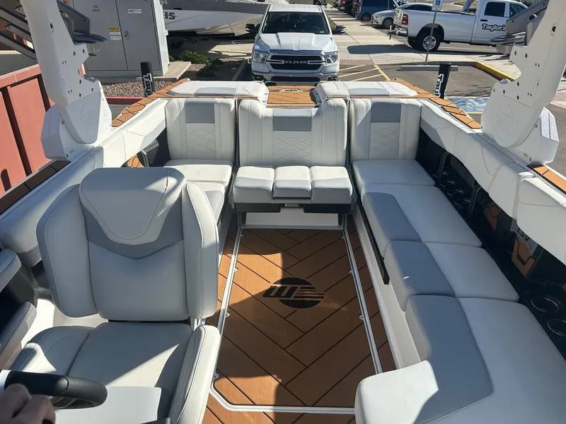 Slide: The Image of 2025 Malibu 23 LSV boat interior with luxurious seating and modern design. - 20