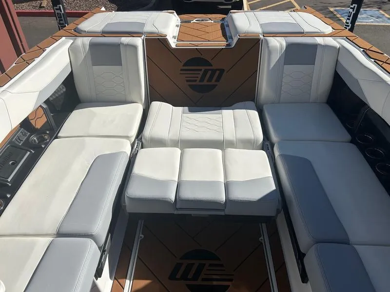 Slide: The Image of Luxurious interior of 2025 Malibu 23 LSV boat with plush seating and modern design. - 21