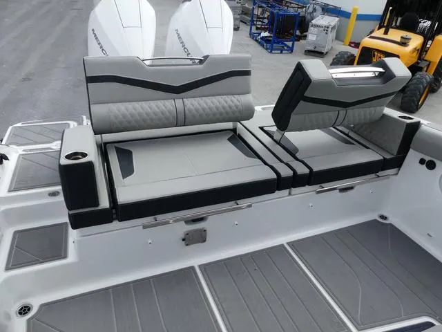 Slide: The Image of 2025 Monterey Elite 30 OB boat with stylish seating and modern design. - 11