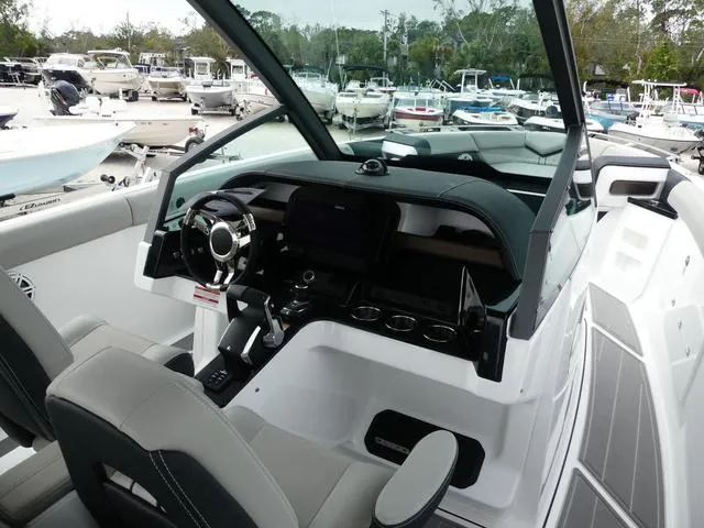 Slide: The Image of 2025 Monterey Elite 30 OB boat interior with modern dashboard and steering wheel. - 20