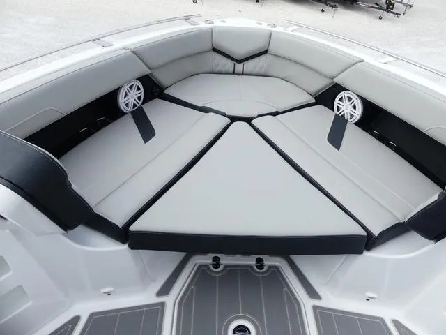 Slide: The Image of 2025 Monterey Elite 30 OB boat interior with cushioned seating and speakers. - 27