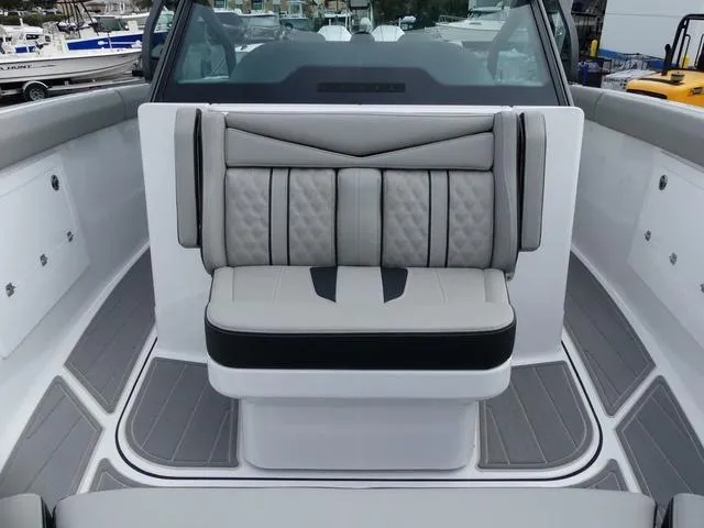 Slide: The Image of 2025 Monterey Elite 30 OB boat interior with stylish seating and modern design. - 28