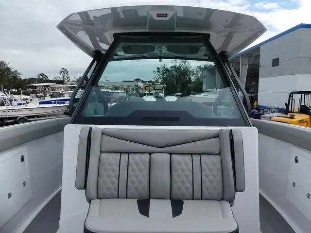 Slide: The Image of 2025 Monterey Elite 30 OB boat with sleek seating and modern design. - 29