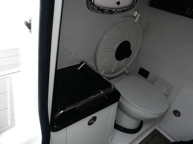 Slide: The Image of 2025 Monterey Elite 30 OB boat bathroom with modern fixtures and compact design. - 33
