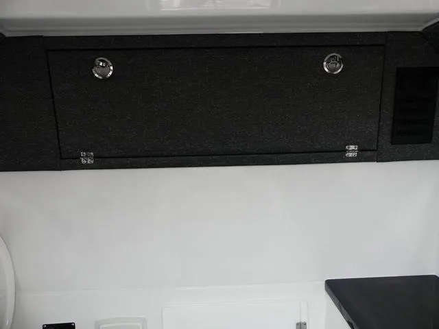 Slide: The Image of 2025 Monterey Elite 30 OB interior storage compartment with sleek design and modern finishes. - 34