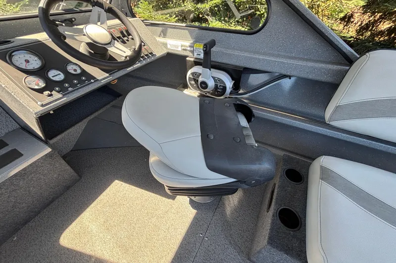 Slide: The Image of Interior of 2025 Spartan 185 Astoria boat with steering wheel and control panel. - 34
