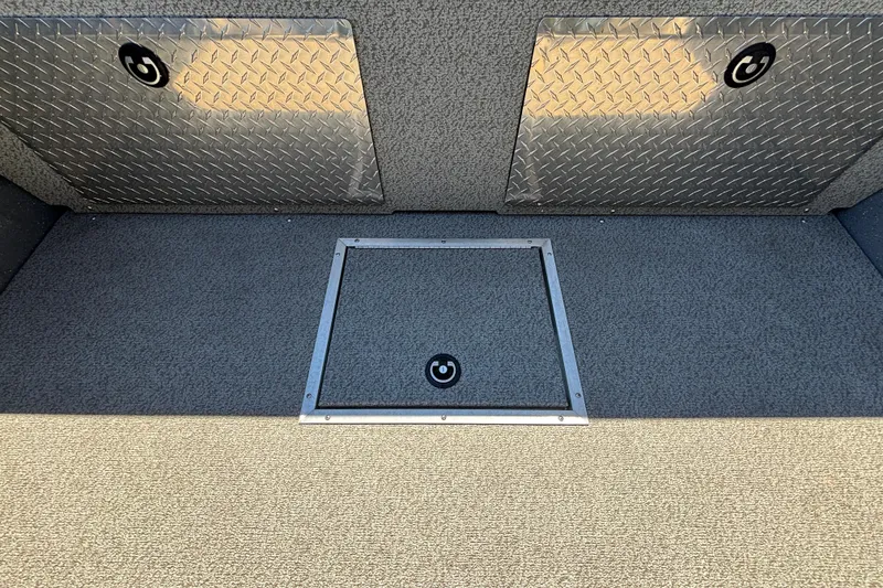 Slide: The Image of 2025 Spartan 185 Astoria boat interior with diamond plate storage compartments. - 19