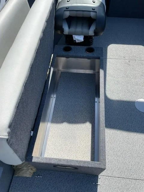 Slide: The Image of 2025 Spartan 185 Astoria boat interior with storage compartment and seating. - 3