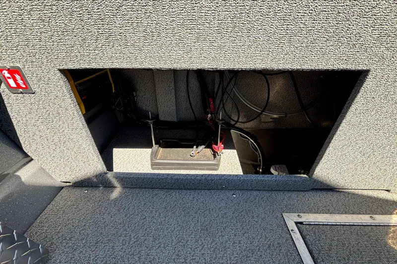Slide: The Image of Interior compartment of 2025 Spartan 185 Astoria boat, showing wiring and equipment. - 21