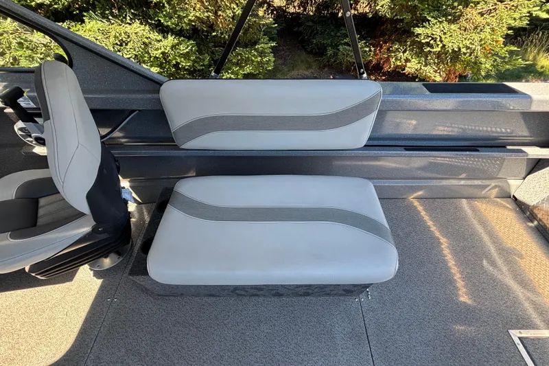 Slide: The Image of Interior seating of 2025 Spartan 185 Astoria boat with gray upholstery. - 28