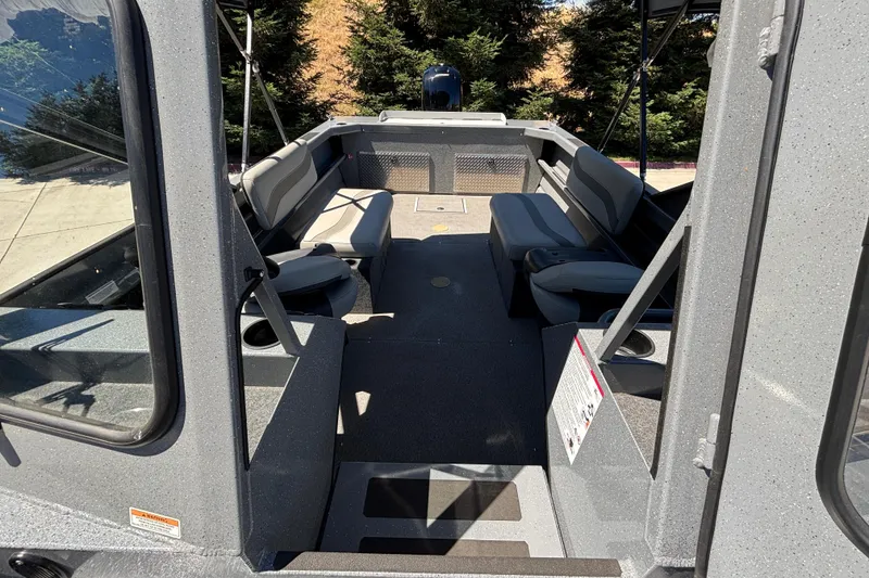 Slide: The Image of Interior view of 2025 Spartan 185 Astoria boat with seating and open deck. - 35