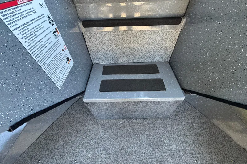 Slide: The Image of Interior of 2025 Spartan 185 Astoria boat with safety instructions and non-slip steps. - 33