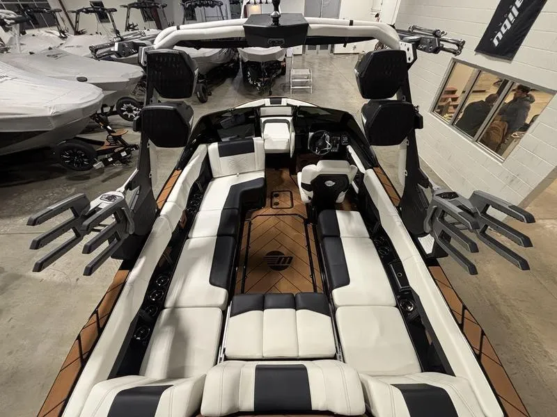 Slide: The Image of 2025 Malibu 23 LSV boat interior with luxurious seating and modern design. - 12