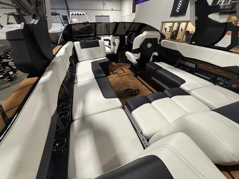 Slide: The Image of Interior of 2025 Malibu 23 LSV boat with luxurious seating and modern design. - 13
